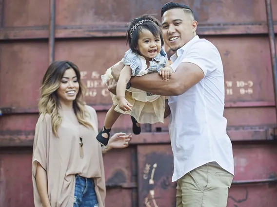 University of Arizona employee holding daughter - Childcare support