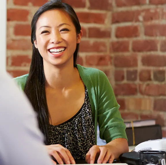 Smiling hiring manager meeting with an applicant